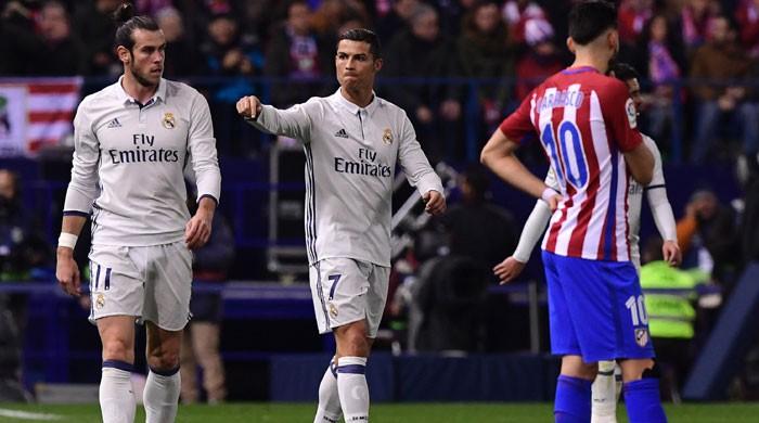 Ronaldo hat-trick downs Atletico, extends Real lead