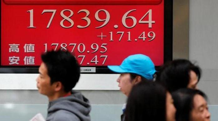 Japan stocks rise to near 11-mth high, dollar bulls continue charge