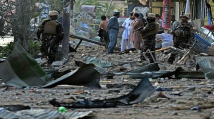 Twin blasts near Afghan parliament kill 21