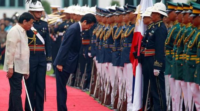 Japan PM Abe visits Philippines as Duterte's first top guest