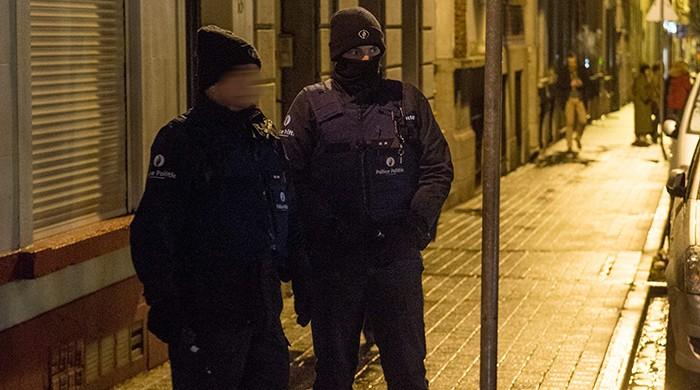 Police take three for questioning after anti-terror raids in Brussels