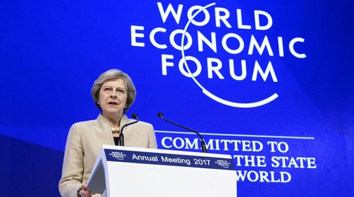 May vows 'open' Britain as banks shift jobs from London May vows 'open' Britain as banks shift jobs from London