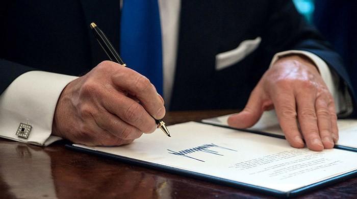 By the stroke of a pen, Trump to ban thousands from entering America