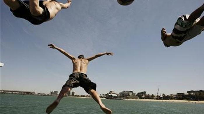 Australia heat wave causes firms to power down but blackouts avoided