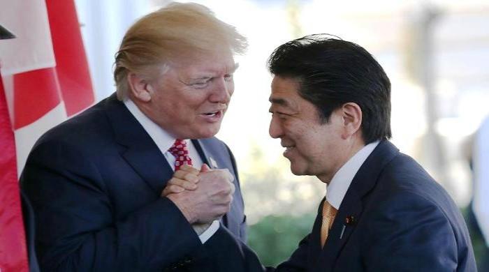 Donald Trump makes Japanese PM uneasy after an awkward handshake