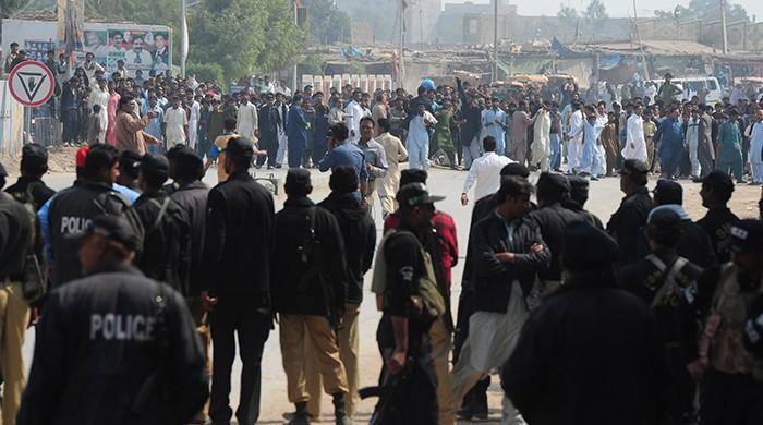 Wielding batons, shouting slogans: Protesters lash out at police in Sehwan