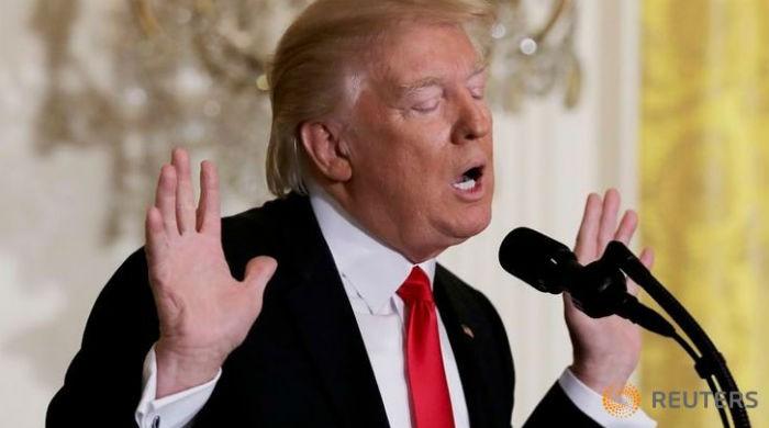 'The press is out of control': Trump on defensive in first solo news conference