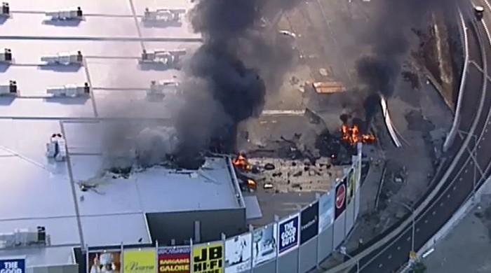 Plane carrying five people crashes into Australian shopping mall