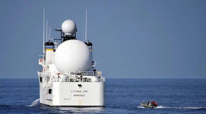 US Navy ship changes course after Iran vessel interaction: US official