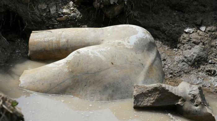 Giant pharaoh statue probably depicting Ramses II found in Egypt slum