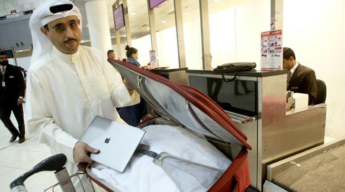 Laptop ban creates turbulence for airline profits