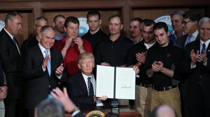 Trump signs order sweeping away Obama-era climate policies