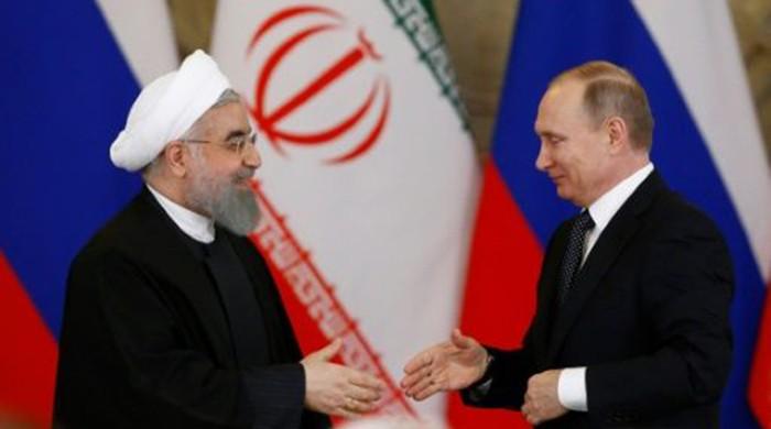 Russia, Iran ink economic deals as Rouhani visits Moscow