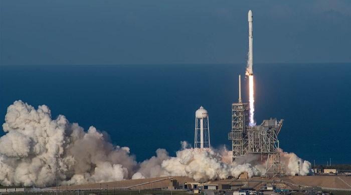 SpaceX launches first recycled rocket booster