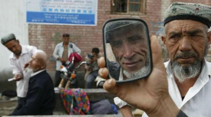 China bans beards, veils in Xinjiang