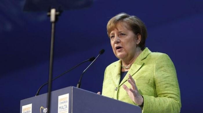 Merkel says migrants must respect tolerance, German laws