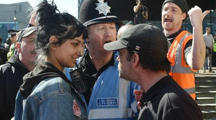 Photo of British-Pakistani woman confronting racist group goes viral