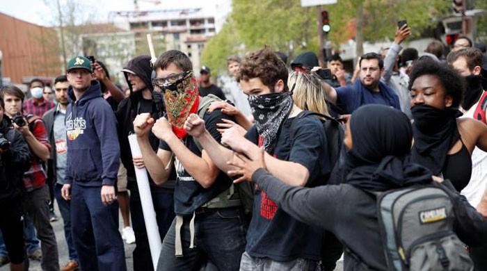 Trump supporters, opponents clash in California park