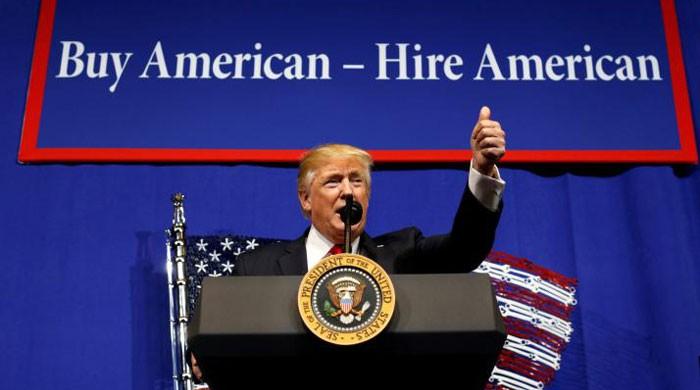 Trump orders review of visa program to encourage hiring Americans