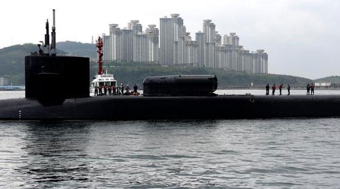 North Korea puts on live-fire drill as US sub docks in South
