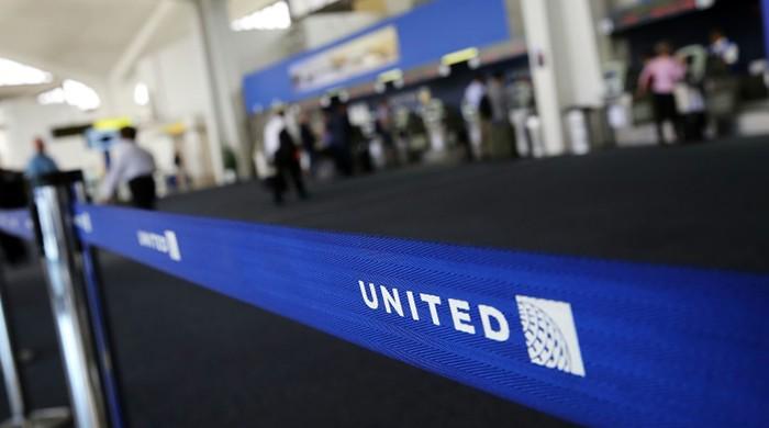 United settles with dragged passenger, changes practices