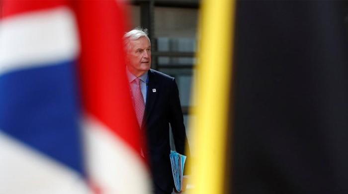 EU sets Britain tough divorce terms, slams budget veto