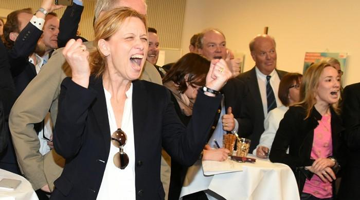 Merkel's party scores strong win in state poll test