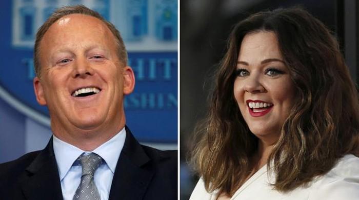 Melissa McCarthy motors through New York dressed as Sean Spicer