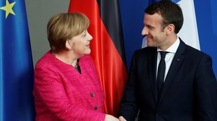 Macron, Merkel vow new momentum for Europe