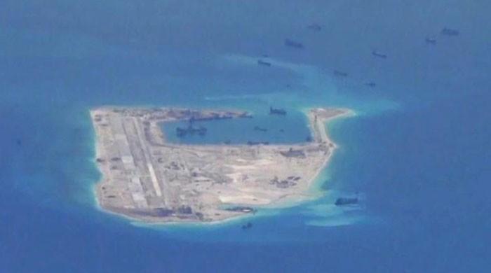 China installs rocket launchers on disputed South China Sea island: report