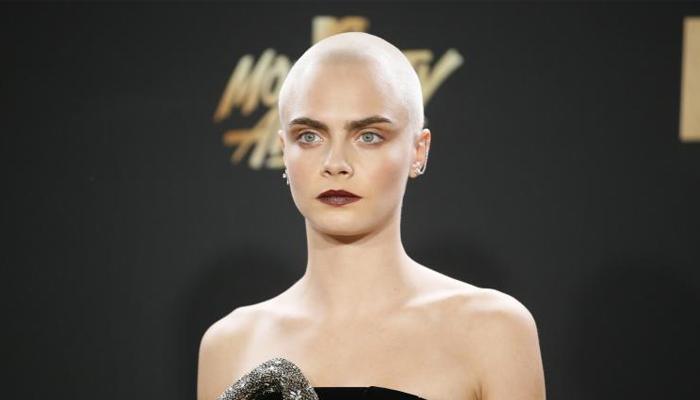 Actress-model Cara Delevingne rocks shaved head at Cannes' Magnum x Moschino party