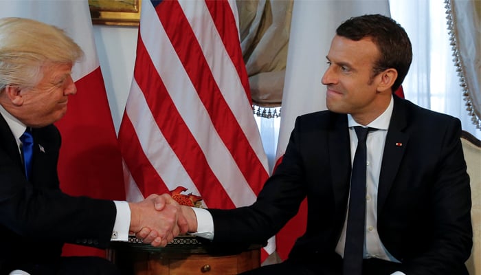 French president Macron trumps Trumps tug-and-hold handshake