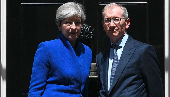 Embattled Theresa May names new Cabinet as critics circle