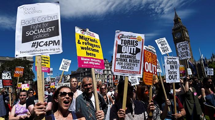 Protestors in London call on Theresa May to resign