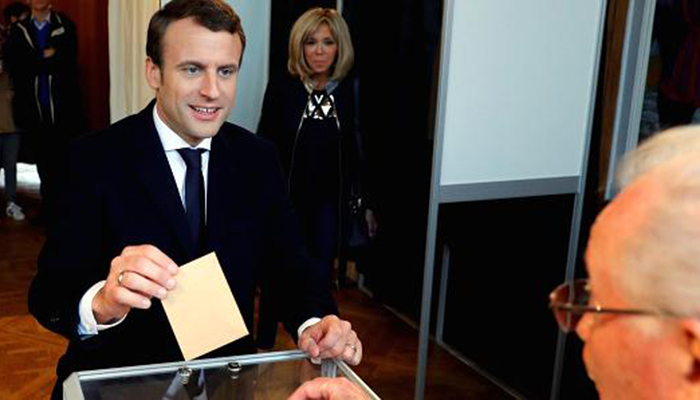 Macron seeks majority as France votes for new parliament
