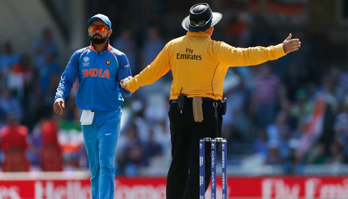 Virat Kohli reacts after a no ball was called after Jasprit Bumrah took the wicket of Pakistan´s Fakhar Zaman