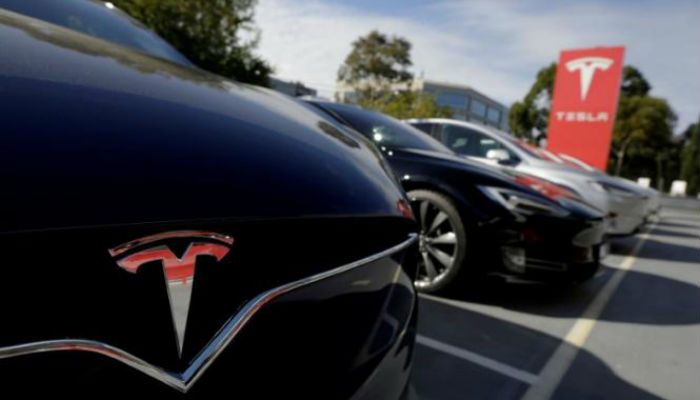 Tesla, others seek ways to ensure drivers keep their hands on the wheel