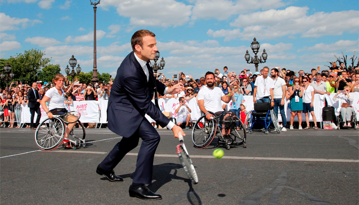 French President shows game side to support Paris 2024