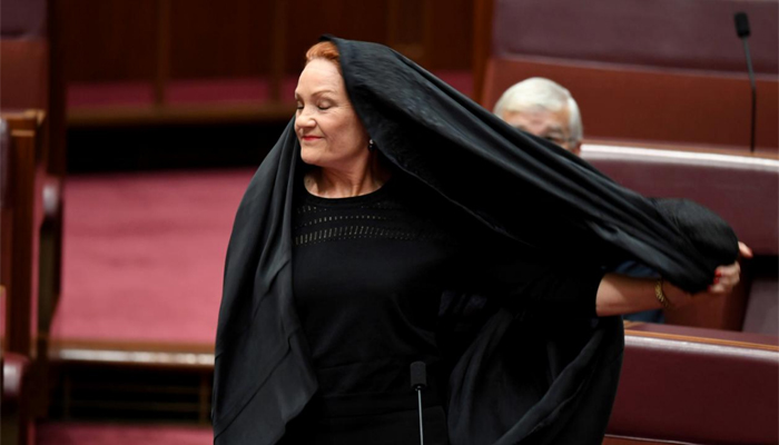 Australia's Hanson wears burqa to parliament in bid to ban them