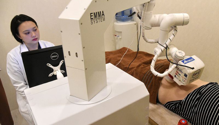 Emma the robot masseuse gets to work in Singapore
