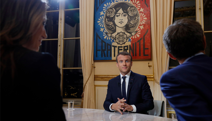 French President Emmanuel Macron looks on before his first interview from the Elysee Palace in Paris, October 15, 2017. AFP/Philippe Wojazer