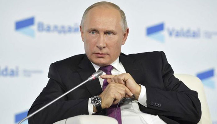 Putin dials up anti-US rhetoric, keeps mum on re-election