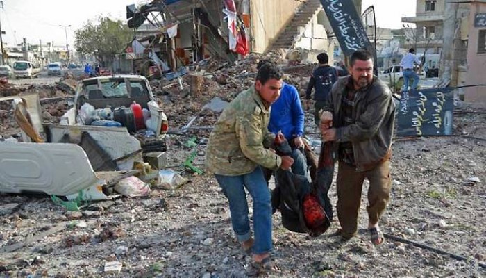 Air raids on market kill 53 in north Syria town