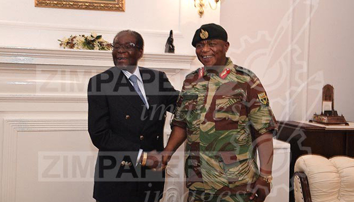 Zimbabwe's Mugabe, coup chief meet with smiles and handshakes