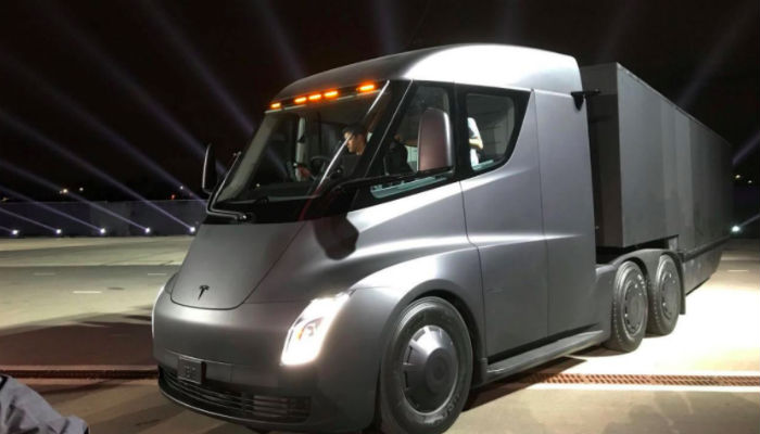 New $200,000 Tesla Roadster speeds in front of electric big-rig truck