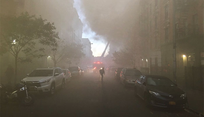 Five wounded as Manhattan building fire rages on