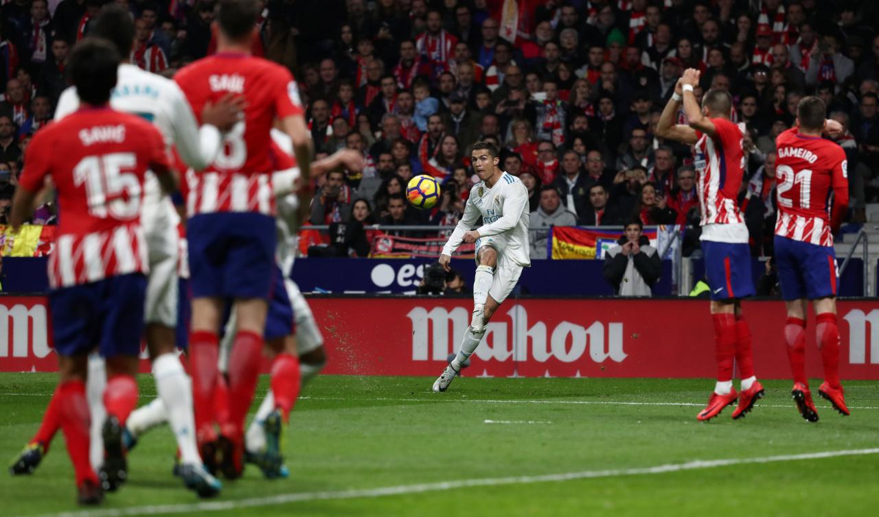 Real title hopes fade further after derby draw at Atletico