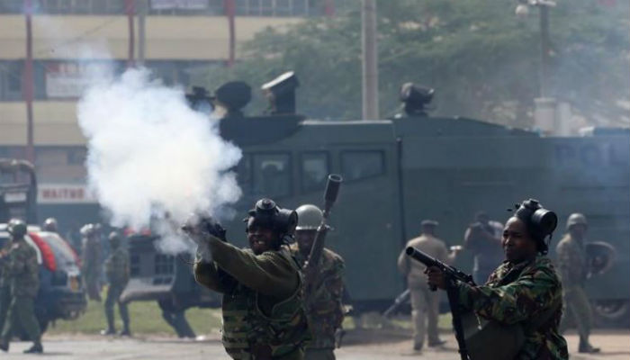 Kenyan police fire teargas to break slum protests after four murdered