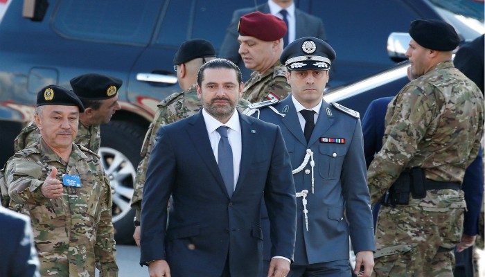 Hariri, back in Beirut, attends national day parade