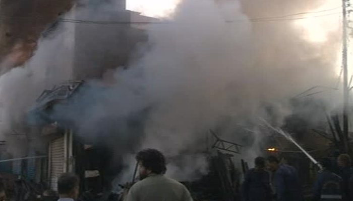 Firefighters douse fire at wood market in Karachi